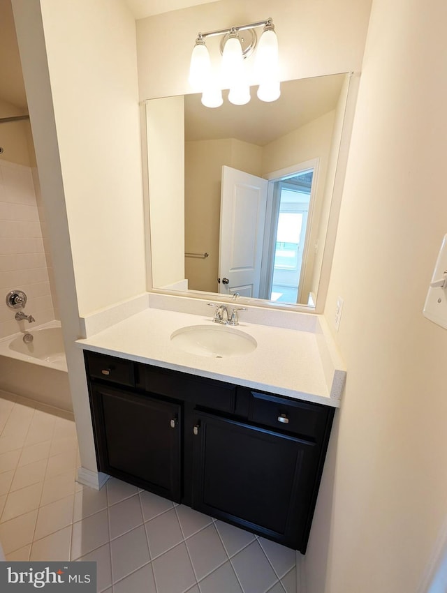 bathroom featuring tub / shower combination, tile patterned flooring, and vanity