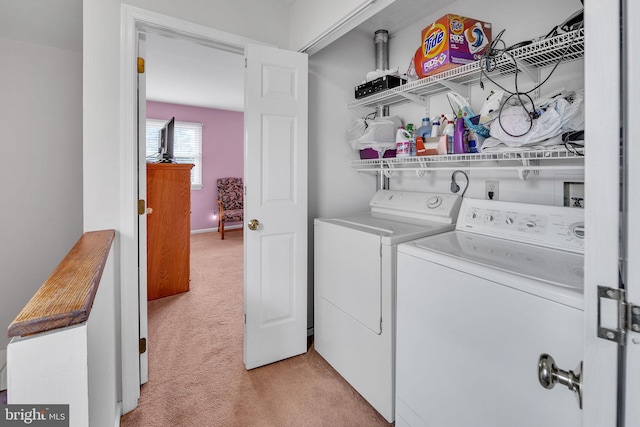 washroom with light colored carpet and washing machine and dryer
