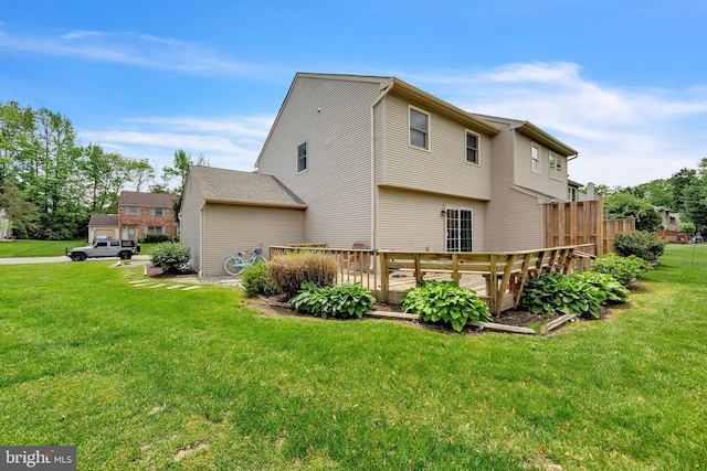 view of side of property featuring a wooden deck and a yard