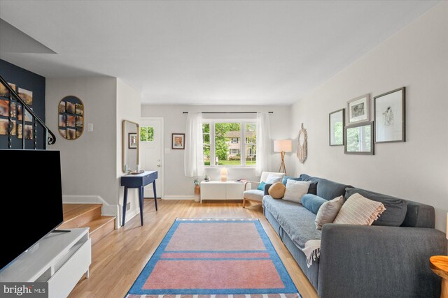 1705 N Cliff St, Alexandria, VA 22301 - living room with light wood-style floors, stairway, and baseboards