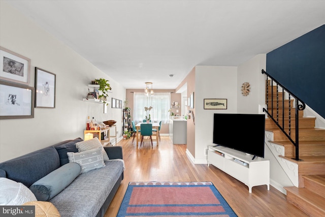 1705 N Cliff St, Alexandria, VA 22301 - living area featuring stairway, wood finished floors, a chandelier, and baseboards
