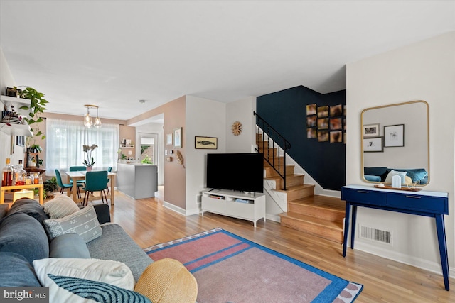 1705 N Cliff St, Alexandria, VA 22301 - living room with stairway, wood finished floors, and baseboards