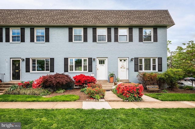 1705 N Cliff St, Alexandria, VA 22301 - colonial house with roof with shingles, mansard roof, brick siding, and a front yard