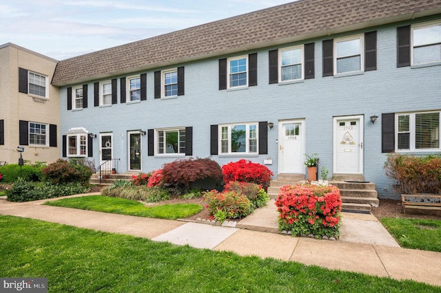 1705 N Cliff St, Alexandria, VA 22301 - view of front facade featuring roof with shingles, mansard roof, and brick siding