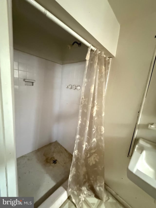 bathroom with a shower with shower curtain