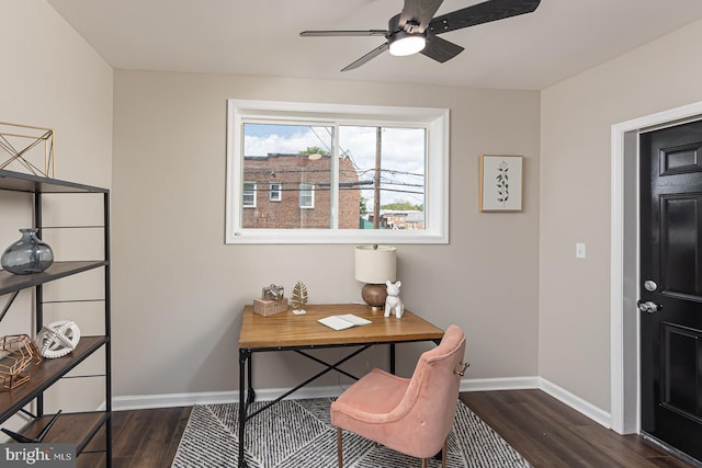 office with dark wood-type flooring, a ceiling fan, and baseboards