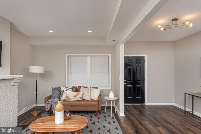 sitting room with baseboards, recessed lighting, wood finished floors, and visible vents