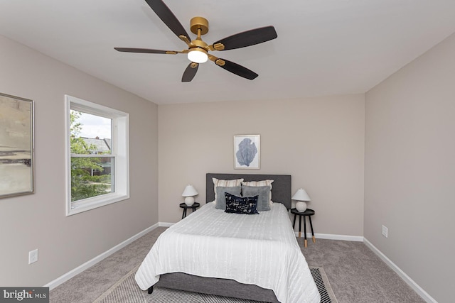 bedroom featuring carpet floors, baseboards, and ceiling fan