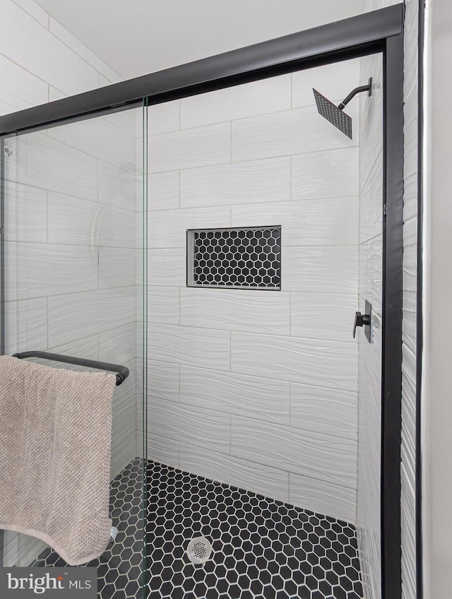 full bath with a shower stall