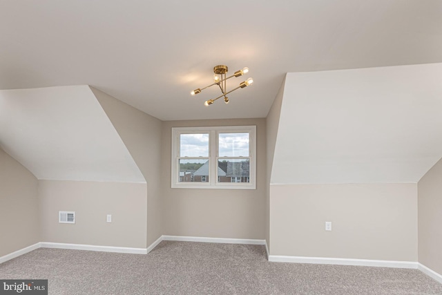 bonus room with baseboards, carpet, and vaulted ceiling
