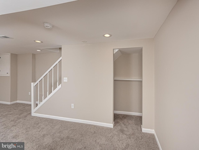 interior space featuring carpet, recessed lighting, and visible vents