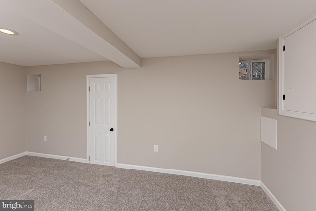 carpeted spare room with baseboards