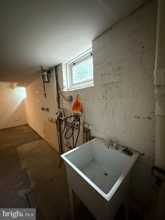 below grade area with a sink