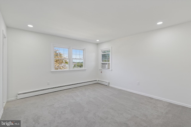 carpeted empty room featuring recessed lighting, a baseboard radiator, and baseboards