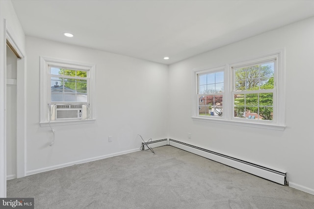 spare room featuring carpet floors, baseboards, baseboard heating, and recessed lighting