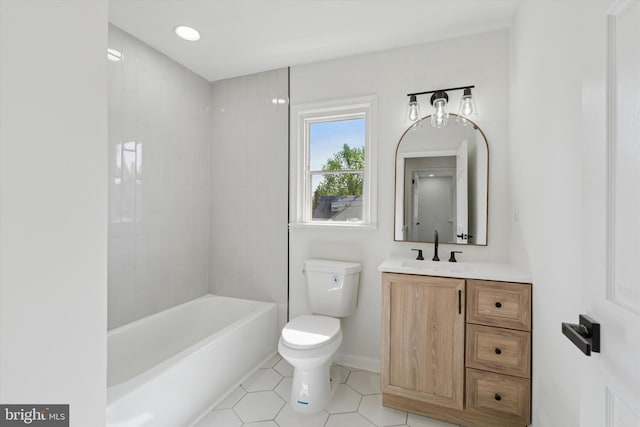 full bath with toilet, tile patterned flooring, and vanity