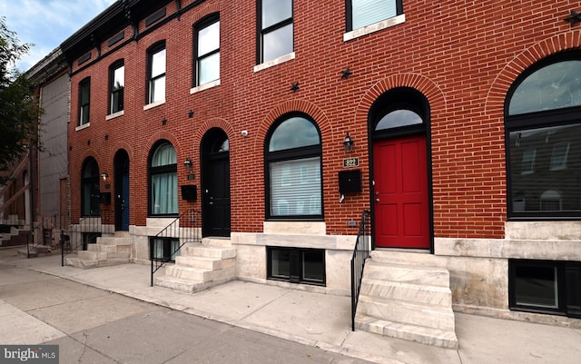 property entrance with brick siding