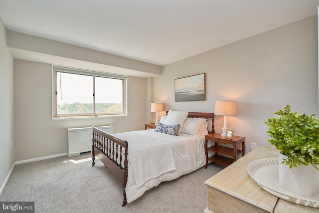 carpeted bedroom with baseboards