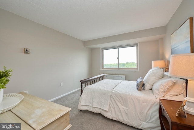 carpeted bedroom with baseboards