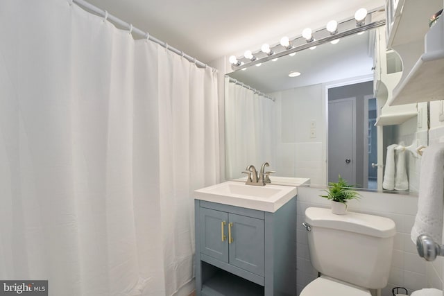 full bath featuring toilet and vanity