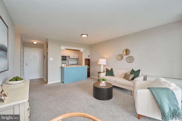 living room with baseboards and light colored carpet