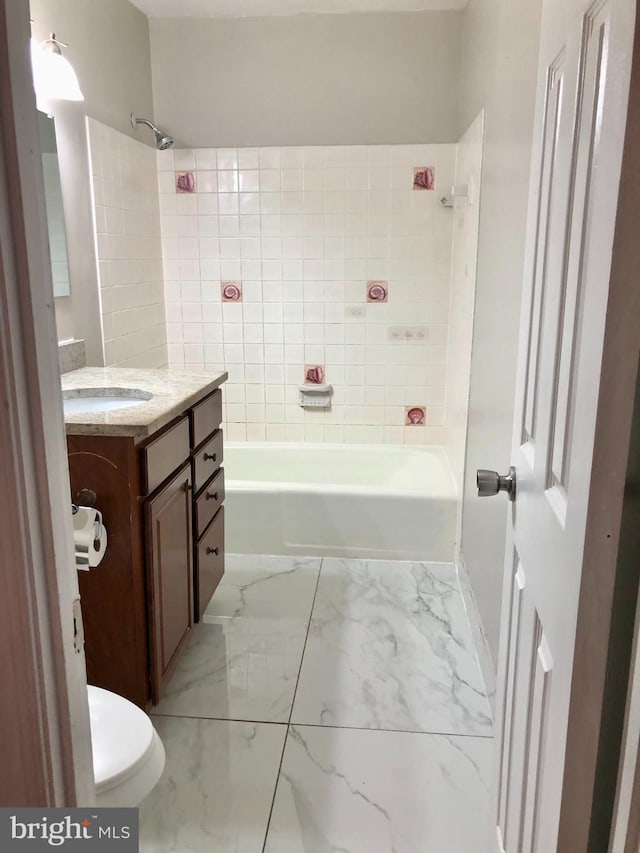 8317 Irongate Way, Manassas, VA 20109 - bathroom featuring marble finish floors, vanity, toilet, and shower / bath combination