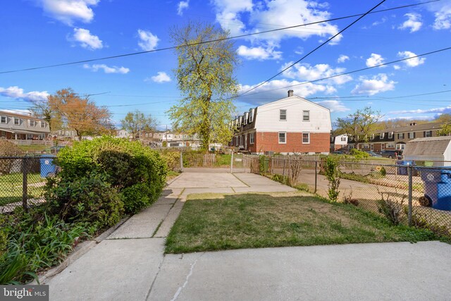 view of yard with a patio, a residential view, and fence private yard