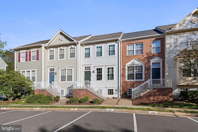 multi unit property featuring uncovered parking