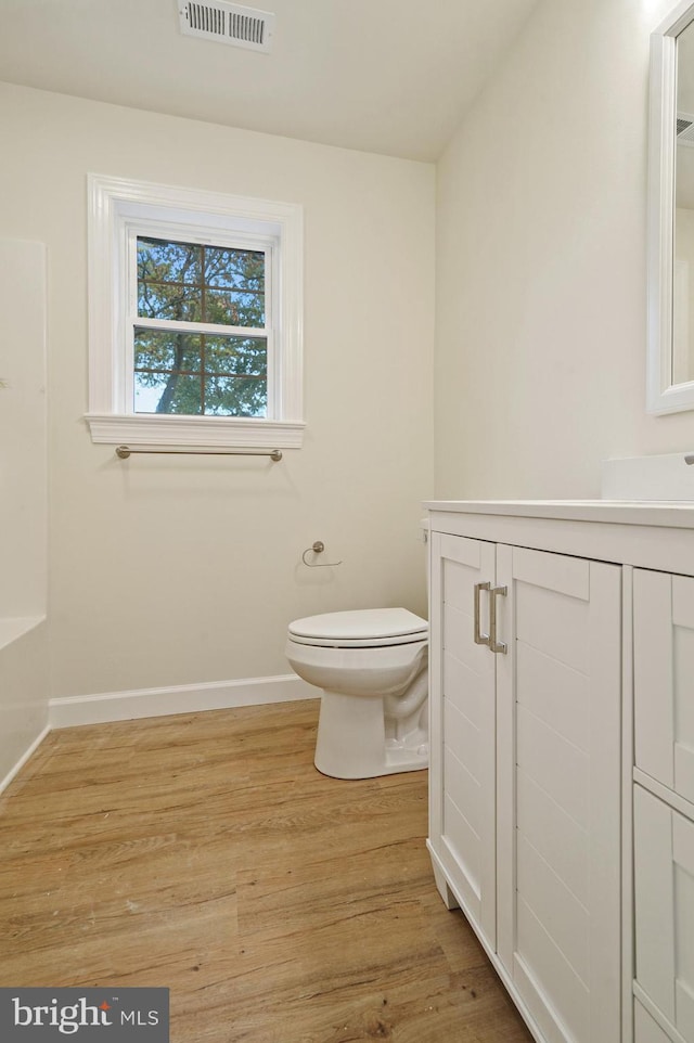 41 S Mechanic St, Camden Wyoming, DE 19934 - bathroom featuring vanity, toilet, baseboards, wood finished floors, and visible vents