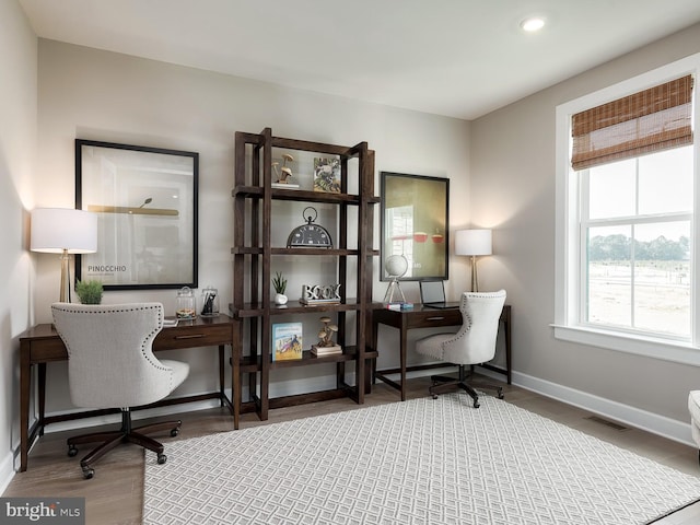 home office with recessed lighting, baseboards, visible vents, and wood finished floors