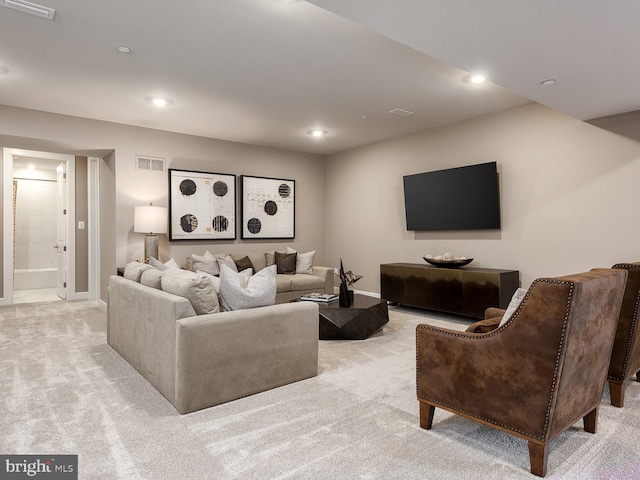living area featuring baseboards, light carpet, recessed lighting, and visible vents