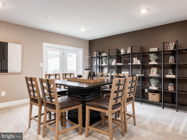 carpeted dining room with baseboards, recessed lighting, and visible vents