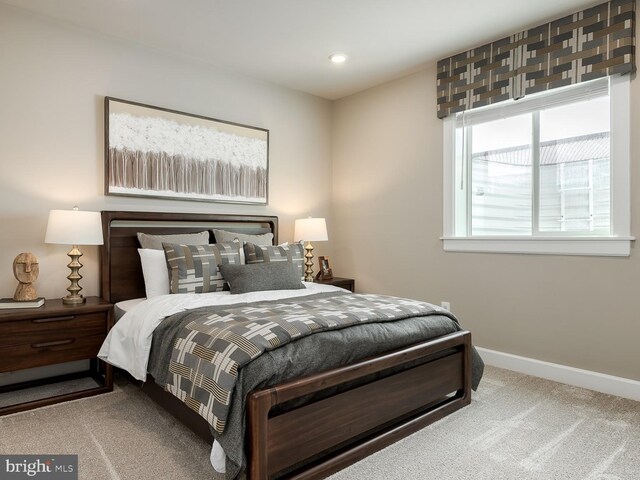 bedroom featuring baseboards, recessed lighting, and carpet
