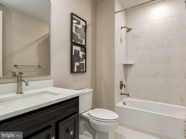 full bathroom featuring toilet, bathing tub / shower combination, marble finish floor, and vanity