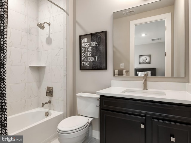 full bathroom with visible vents, tub / shower combination, toilet, and vanity