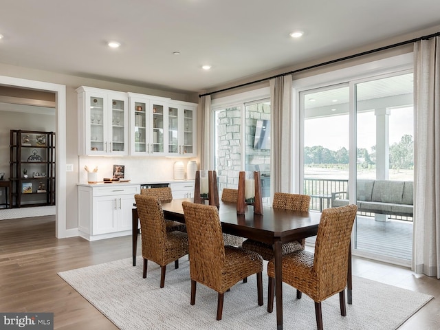 dining room featuring light wood-type flooring and recessed lighting
