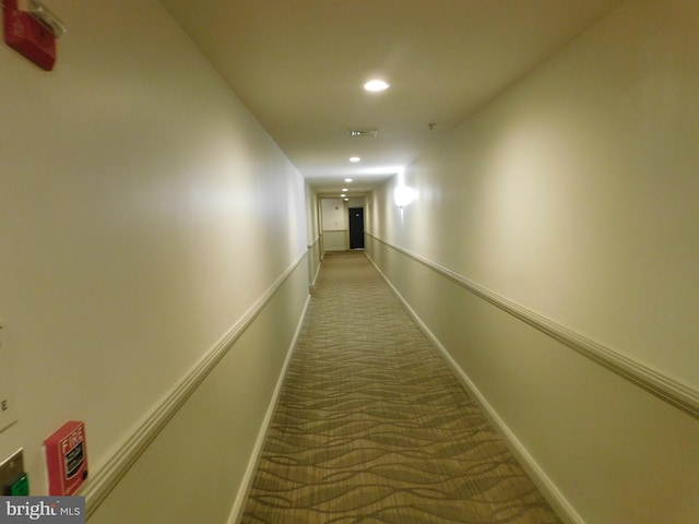 hallway with recessed lighting, baseboards, and carpet