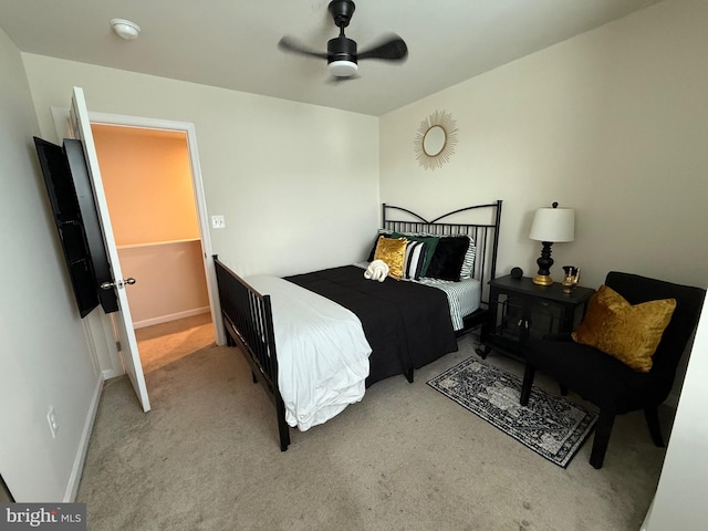 bedroom with carpet flooring, a ceiling fan, and baseboards