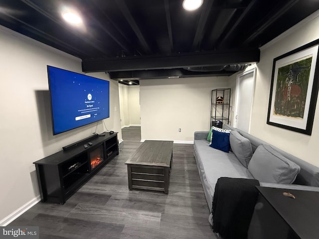 living area featuring baseboards and dark wood-type flooring