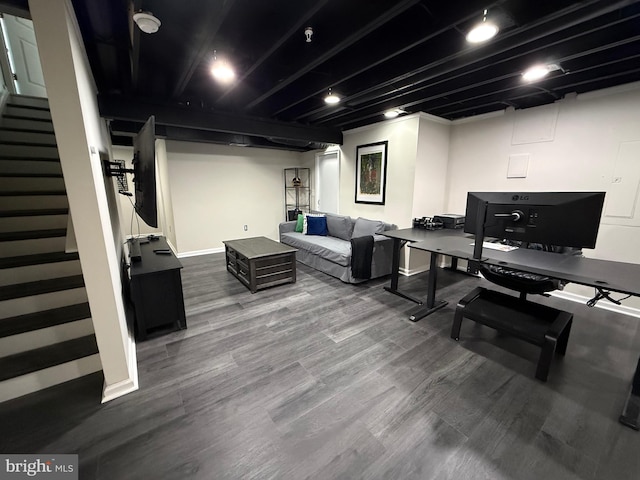 interior space featuring baseboards and wood finished floors