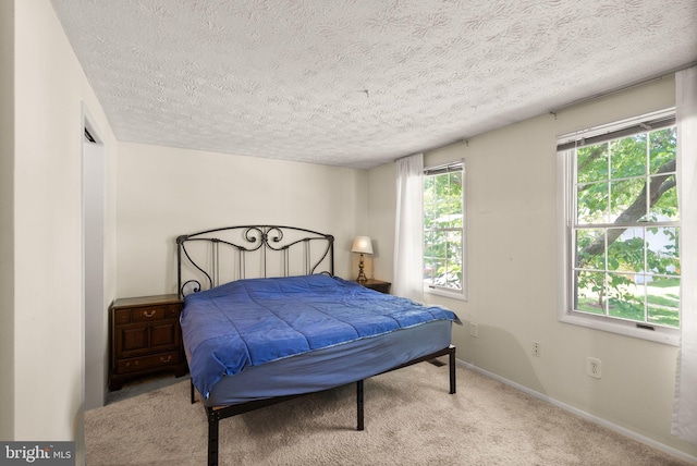 8337 Wind Fall Rd, Springfield, VA 22153 - carpeted bedroom featuring a textured ceiling and baseboards