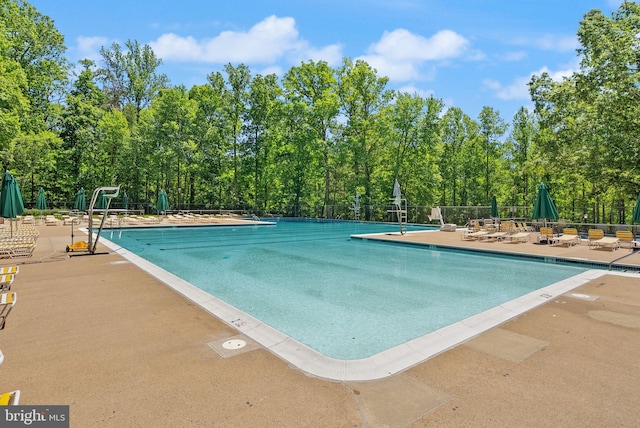 8337 Wind Fall Rd, Springfield, VA 22153 - community pool featuring a patio area