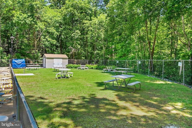 8337 Wind Fall Rd, Springfield, VA 22153 - view of yard with an outbuilding and a wooded view