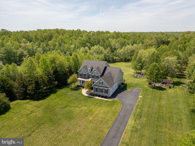 view from above of property with a forest