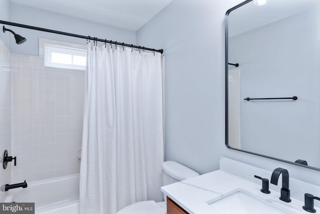bathroom with toilet, shower / bath combo, and vanity