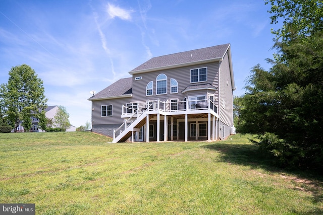 rear view of house with stairs, a deck, a yard, and a shingled roof