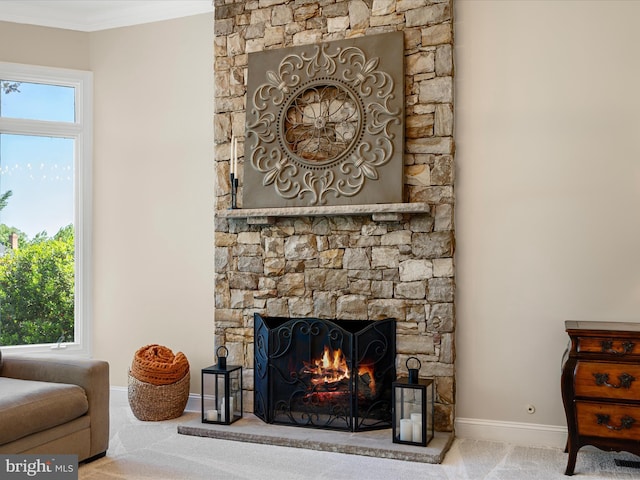 detailed view of carpet floors, baseboards, a fireplace, and ornamental molding