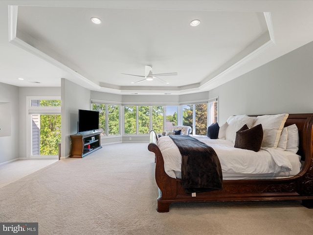 bedroom with a raised ceiling, carpet flooring, recessed lighting, and ceiling fan