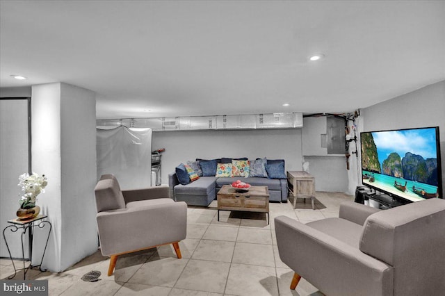 living area featuring light tile patterned floors and recessed lighting