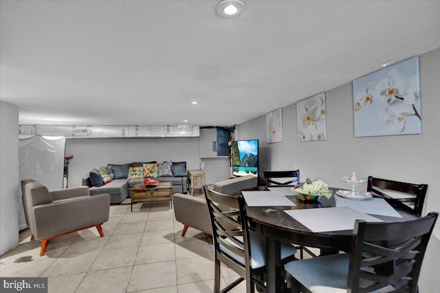 dining room with light tile patterned floors and recessed lighting